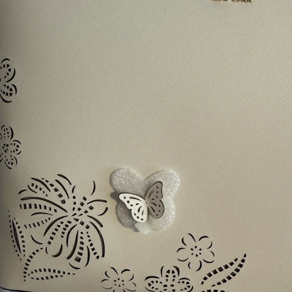 kate spade Cream Tote with Decorative Cutouts and Scarf Accent